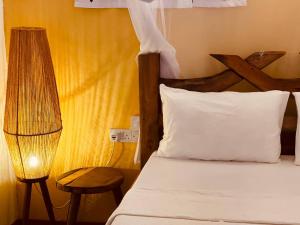 Ein Bett oder Betten in einem Zimmer der Unterkunft Babalao Bungalows