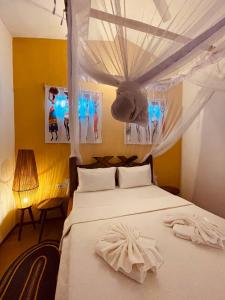 Ein Bett oder Betten in einem Zimmer der Unterkunft Babalao Bungalows