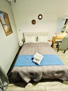 Posteľ alebo postele v izbe v ubytovaní Villa Arietta Santorini