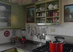 a kitchen with a stove with a pot on the stove at Dorraine's Jerusalem Bed & Breakfast in Jerusalem