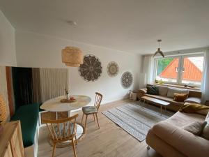a living room with a table and a couch at mieszkanko_karkonoska in Jelenia Góra