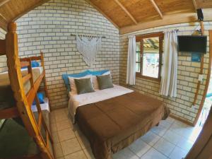 Haleakala Hostel & Pousada tesisinde bir odada yatak veya yataklar