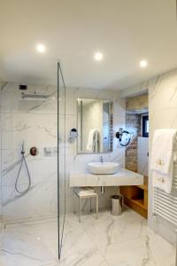 a bathroom with a sink and a shower at Relais & Spa Castello di Casiglio in Erba