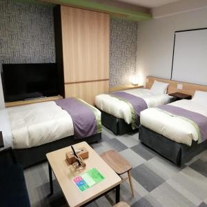 Postel nebo postele na pokoji v ubytování Hotel Yururito Osaka