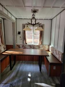 a dining room with a table and a window at Greer Point Trails End Cabins in Greer
