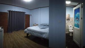 Postel nebo postele na pokoji v ubytování หลับสบายที่ดอยตุง Zuh meh ja Home lodge