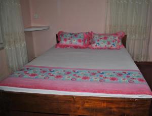 Postel nebo postele na pokoji v ubytování Deniyaya Guest House
