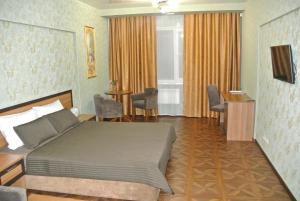 Кровать или кровати в номере Бутик-Отель Сургут