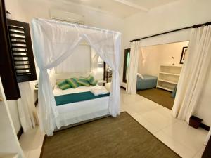 Postel nebo postele na pokoji v ubytování Mangueira Boutique Hotel Moreré