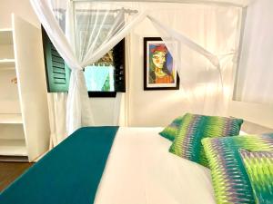 Postel nebo postele na pokoji v ubytování Mangueira Boutique Hotel Moreré