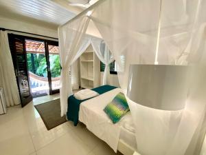 Postel nebo postele na pokoji v ubytování Mangueira Boutique Hotel Moreré