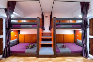 Postel nebo postele na pokoji v ubytování Kerton Hostel