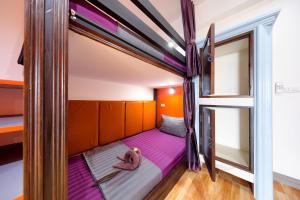Postel nebo postele na pokoji v ubytování Kerton Hostel