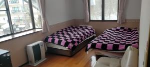 Photo de la galerie de l'établissement Guesthouse Aozora Blue Sky, à Myōkō