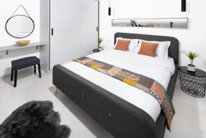 A bed or beds in a room at Andos Cozy & Luxury Upgraded Apartments