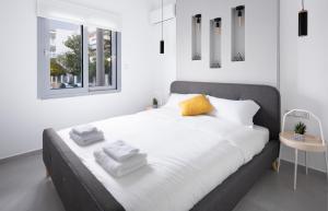 A bed or beds in a room at Andos Cozy & Luxury Upgraded Apartments