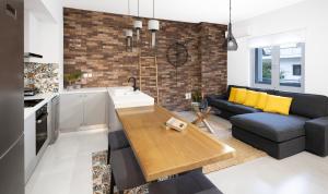 A kitchen or kitchenette at Andos Cozy & Luxury Upgraded Apartments