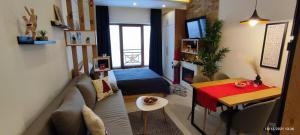 a living room with a couch and a table at SANS Lux Apartman N42 Milmari Kopaonik in Kopaonik