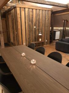 a conference room with a wooden table and chairs at Storbo Adventure Camp in Storbo