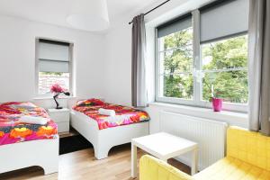 Postel nebo postele na pokoji v ubytování Costa Apartments