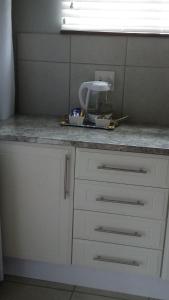 a kitchen counter with a mixer on top of it at 19 Mirabelle Place in Pietermaritzburg