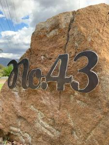 a sign on a rock with the word on it at No43 Studio apartment in Mount Beauty