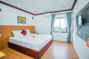 Giường trong phòng chung tại SenDa villa & apartment