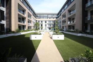 an empty courtyard in an apartment building at APARTMENTS GH - Accra - Cantonments - Embassy Gardens in Accra