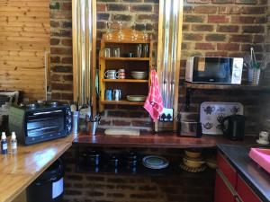 Η κουζίνα ή μικρή κουζίνα στο Serenity Guesthouse