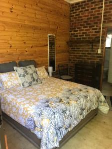 Ένα ή περισσότερα κρεβάτια σε δωμάτιο στο Serenity Guesthouse