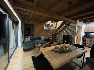 a living room with a table and a couch at wLesie Domek w Górach Pieniny in Krościenko