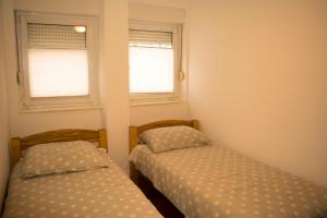 Un pat sau paturi într-o cameră la Apartman Bosa
