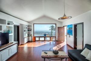 a living room with a view of the ocean at Villa Atlantis I in La Asomada
