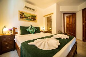 Postel nebo postele na pokoji v ubytování Turay Hotel