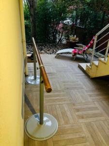 a baseball bat on a stand on a porch at Lovely Escape House in a Frame with Garden in Istanbul