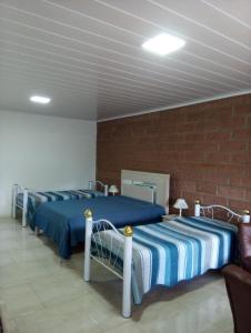 Katil atau katil-katil dalam bilik di Pousada Apartamento na Serra +46 gambar