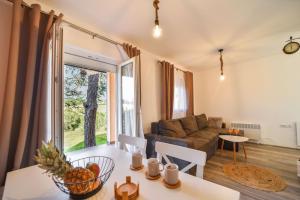 a living room with a couch and a table at Vila Čarna Zlatibor in Zlatibor