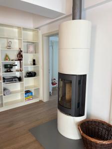 a living room with a fireplace in a room at Brig City Mountain View in Brig