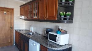 Kuchyň nebo kuchyňský kout v ubytování MyRiverPlace River View Porto apartments