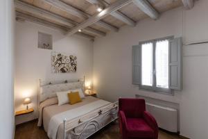 Posteľ alebo postele v izbe v ubytovaní Albergo Diffuso Monopoli