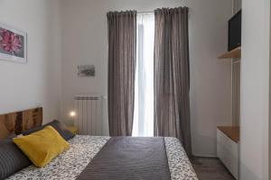 Posteľ alebo postele v izbe v ubytovaní Albergo Diffuso Monopoli