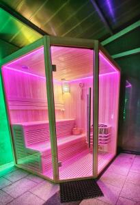 a room with purple lights in a room at Cabana Supporter -Supporter Chalet in Porumbacu de Sus