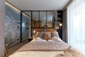 Postel nebo postele na pokoji v ubytování Tatra Square Apartments