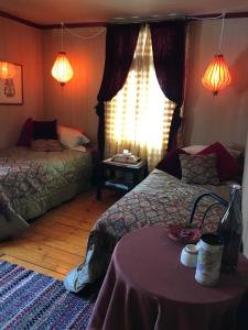 Letto o letti in una camera di Gîte au Toit Bleu
