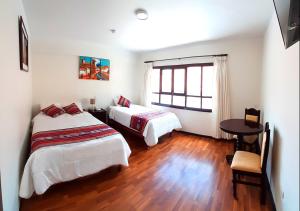Cama ou camas em um quarto em Hotel Santa Maria