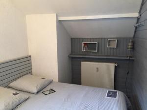 Postel nebo postele na pokoji v ubytování Gîte chaleureux au lac de Payolle