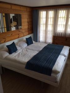Postel nebo postele na pokoji v ubytování Mazot Zermatt