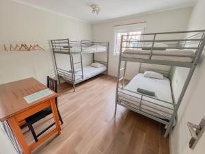 
A bunk bed or bunk beds in a room at Barbatuke Eco-Homestel
