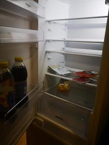 an open refrigerator with food and drinks in it at NEW STUDIO in ARCADIA in Odesa