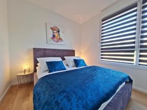 Postel nebo postele na pokoji v ubytování Apartment StellaMare